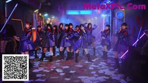 A group of young women in school uniforms posing for a magazine.