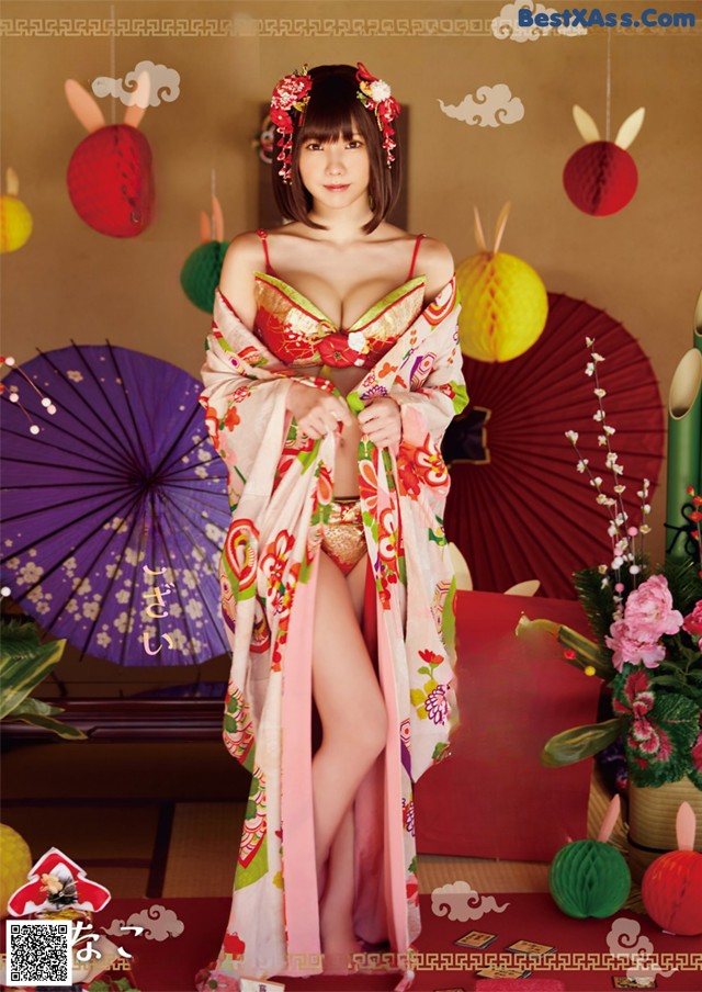 A woman in a kimono is posing for a picture.