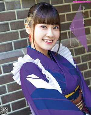 A woman in a brown and white outfit is posing for a picture.